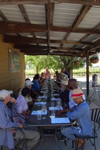 Getting ready to taste the fall white wines lineup at a long table on the patio