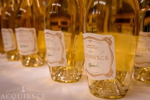 Acquiesce White Wines on a Table